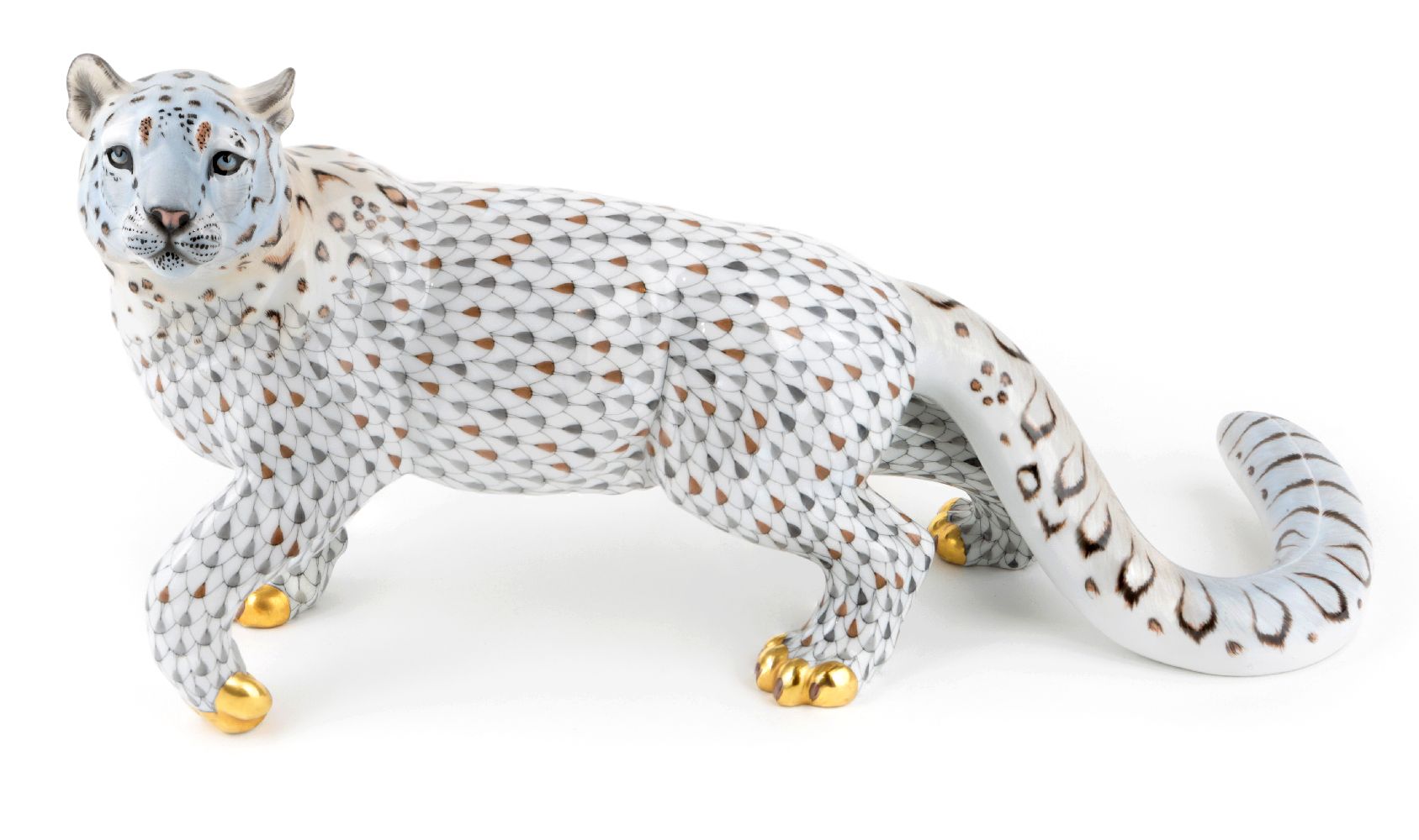 A Herend porcelain model of a snow leopard, late 20th century, decorated in the fish scale pattern