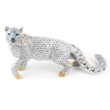 A Herend porcelain model of a snow leopard, late 20th century, decorated in the fish scale pattern