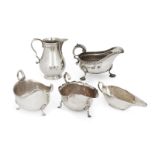 Five silver cream and gravy jugs, including a baluster shaped example, London, 1913, Lambert &