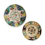 Two Kutahya pottery dishes, Ottoman Turkey, 18th century, of rounded form, each on a short foot, the