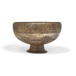 A inscribed and inlaid footed bronze bowl, Iran, 13th-14th century, on a high, spreading foot, the