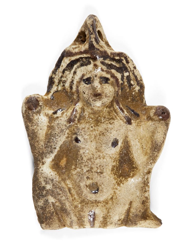 An ancient Egyptian white faience amulet of the Greco-Egyptian goddess Baubo, circa 1st century