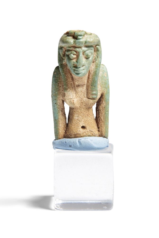 A Late period Egyptian faience amulet of a goddess, wearing a uraeus, fragmentary: torso and head