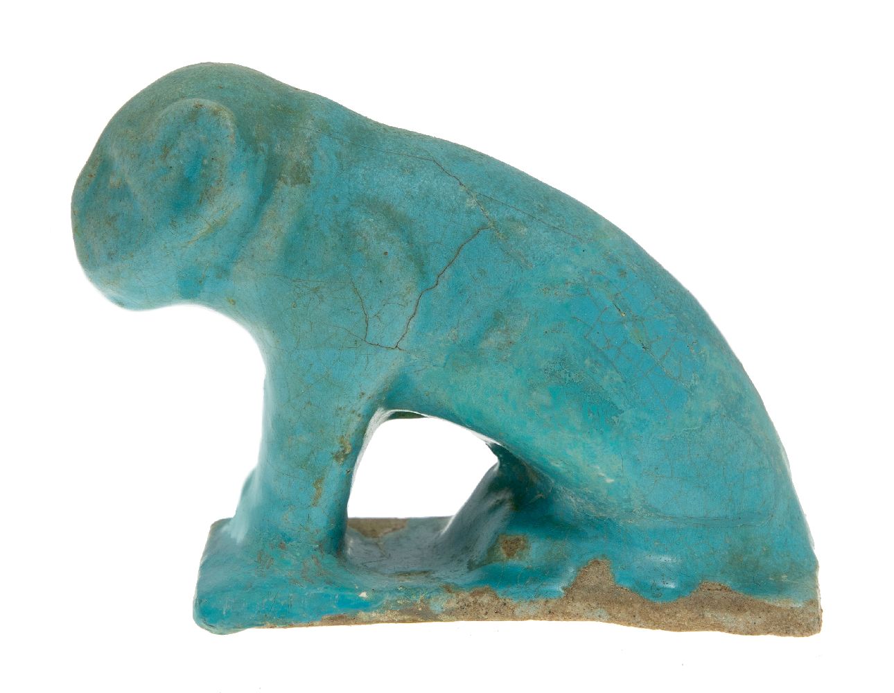 A Kashan moulded turquoise glazed pottery figure of a lion, Iran, 12th century, on a rectangular - Image 2 of 2