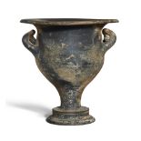 An Apulian black glazed bell krater with up-turned handles on a pedestal base, Magna Graecia,