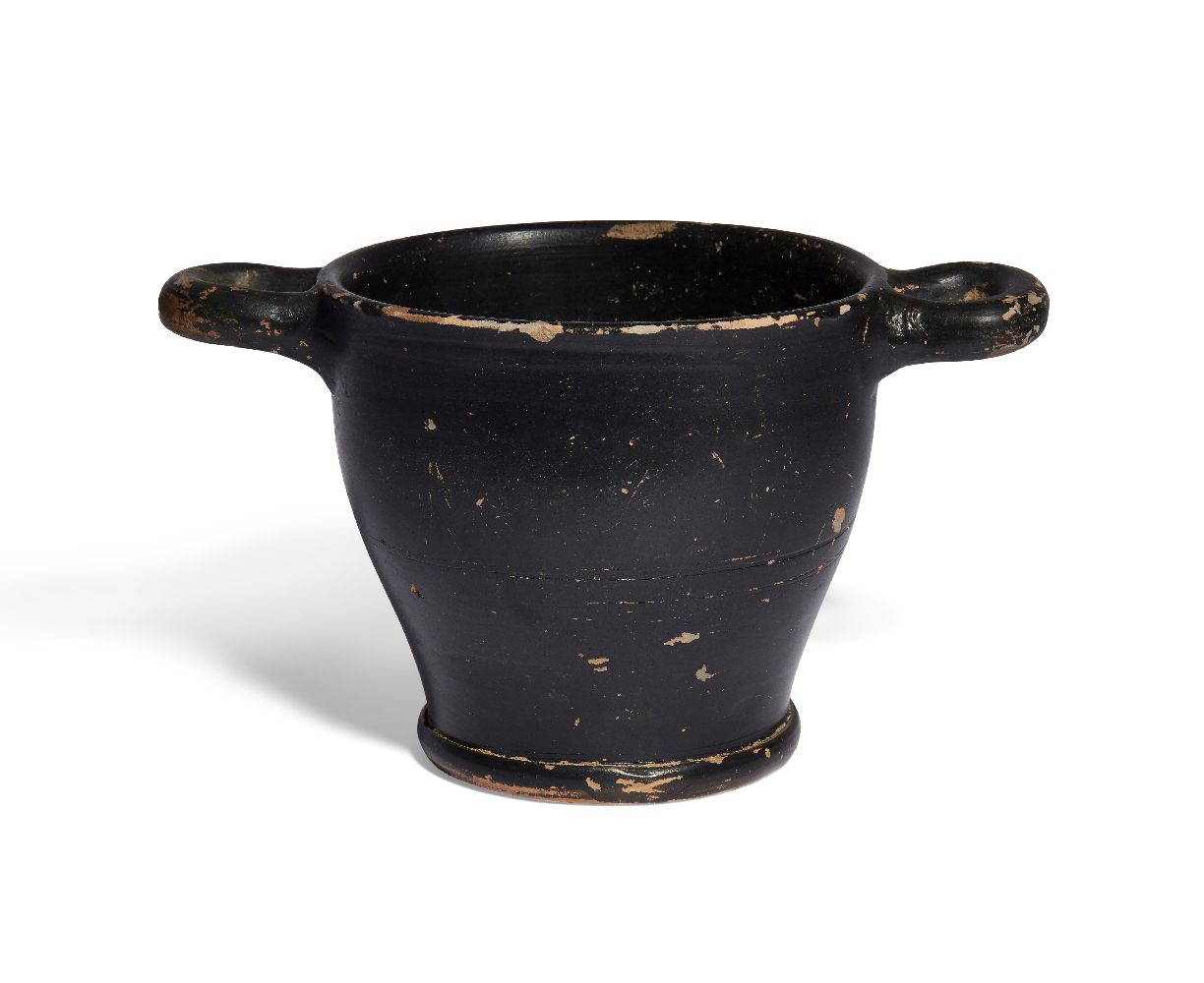 A Greek black glazed skyphos, with ring and dot motif on the underside of the base, circa 5th-4th