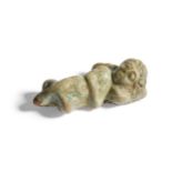 A Romano-Egyptian sleeping cupid in faience from the rim of a bowl, 1st-3rd century A.D. Provenance:
