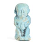 An Egyptian bright blue faience amulet of Pataikos, Late to Ptolemaic Period, circa 600-30 B.C., the