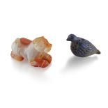 A lapis lazuli bird and a chalcedony recumbent figure of a feline, Not Ancient, 4.1 cm and 4.3 cm