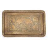 An Armenian engraved brass tray, Iran, early 20th century, of rectangular form, engraved with a