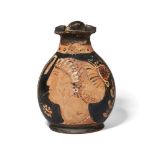 An Apulian red-figure trefoil lipped oinochoe, decorated with the head of a lady of fashion