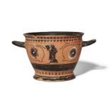 A Greek style black-figure eye cup, one side decorated with a dancing satyr holding a skyphos, the