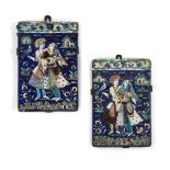 A pair of Qajar moulded pottery tiles, Iran, 19th century, on metal mounts, each of rectangular