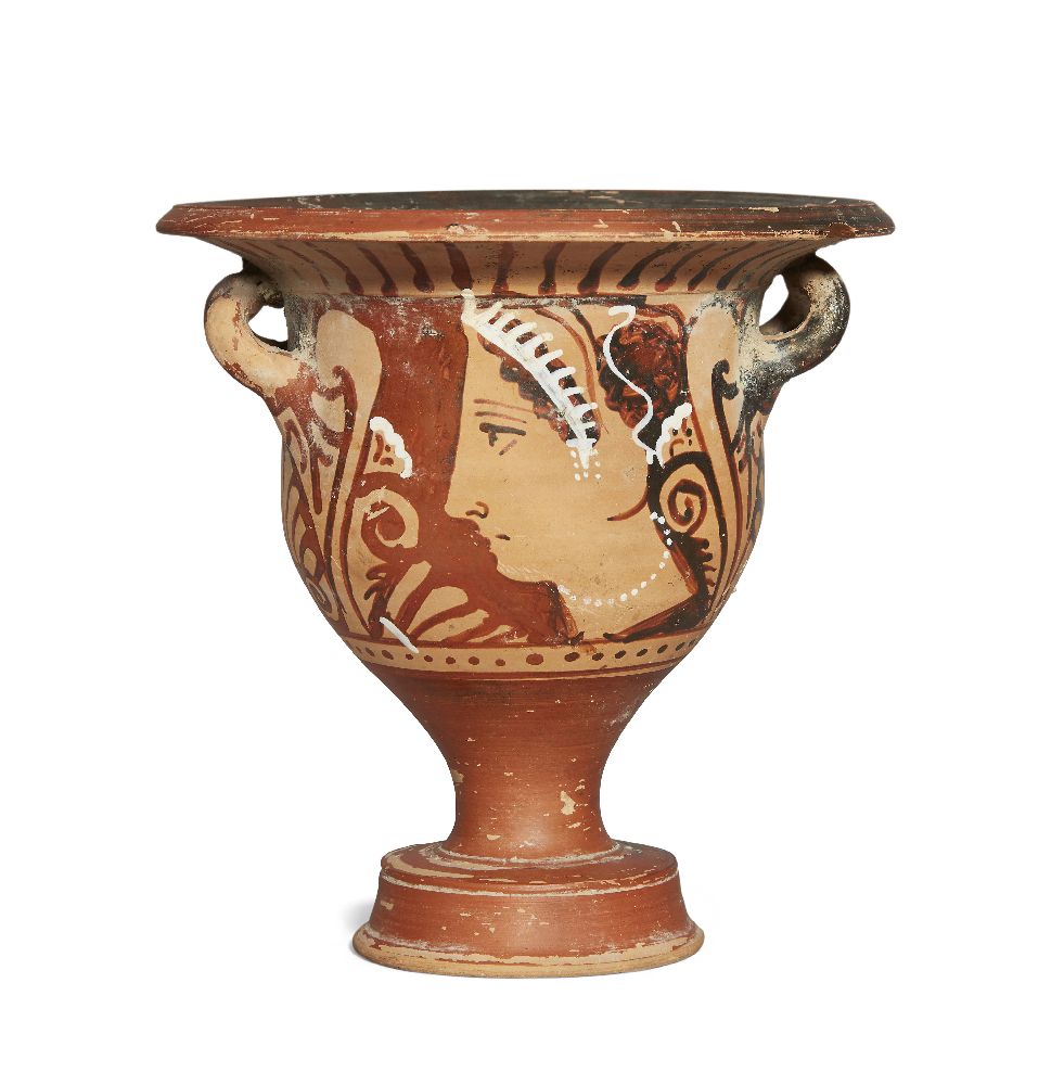 A small Apulian red-figure bell krater, each side decorated with the head of a lady of fashion