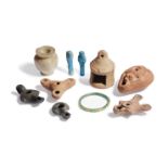 A miscellaneous group of antiquities, including an Egyptian Middle Kingdom alabaster kohl jar, circa