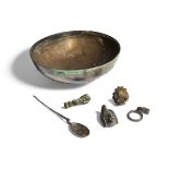 Five Roman bronze objects, including an appliqué head of Attis wearing the Phrygian cap, 3.8cm high;