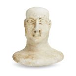A Bactrian marble head from a composite figure, circa late 3rd - early 2nd Millenium B.C., 8.6cm.