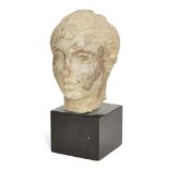 A Gandhara stucco head of youth, 5th-6th century AD, His face modelled with serene expression and