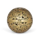 A brass openwork shadow sphere, Iran, late 19th century, hinged at mid-section, the rotating