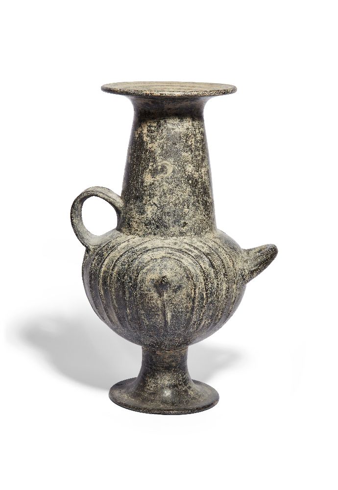 A Villanovan impasto ware urn, 8th Century B.C., the bulbous body decorated on each side with a