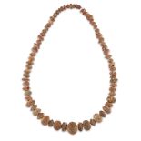 A restrung necklace composed of amber beads, including nine melon beads of various sizes, a