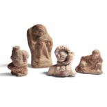 Four terracotta sculptures, including a reclining female figure, her left arm resting on a low