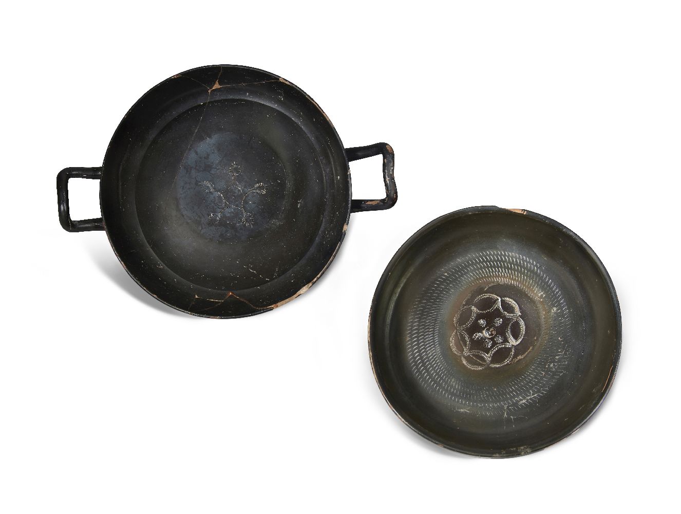 An Apulian black glazed kylix, the tondo with impressed linked palmette design, 29.5cm diam and a - Image 2 of 3