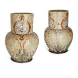 Louisa E Edwards (British Fl.1873-1890), a pair of large Doulton Lambeth stoneware vases with pâte-