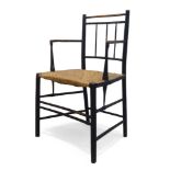 An ebonised beech and rush seated chair, in the manner of Morris & Co. Late 19th Century, With