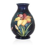 William Moorcroft (1872-1945), a Fresia pattern ceramic vase, c.1935, signed WM, impressed Moorcroft