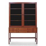 Peter Løvig Nielsen (Danish), a teak and glazed cabinet on stand for Lovig Design, c.1965,