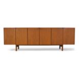 Robert Heritage (British b.1927), a teak sideboard for Archie Shine, c.1960, With six cupboard