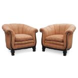 A pair of French Art Deco tub armchairs, c.1920, The rounded and curved backs, with scrolling