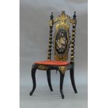 A Victorian ebonised and mother of pearl inlaid side chair, the solid back decorated with a bunch of