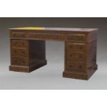 A George III style painted walnut pedestal desk, late 19th/early 20th century, inset leather