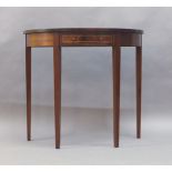 A Georgian style mahogany demi lume console table, stamped ‘M.J.More’, 75cm high, 84cm wide, 42cm