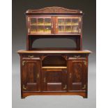 A mahogany display cabinet, second half 20th Century, the top section with raised three quarter