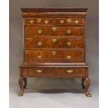 A George II and later walnut and crossbanded chest on stand, the moulded cornice above blind