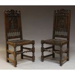 A near pair of late Victorian carved oak side chairs, each panel back carved with a crusader and