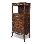 A Chinese hongmu collector's cabinet, late Qing dynasty, with open shelf above seven carved