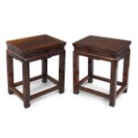 A pair of Chinese yumu rectangular stools, 19th century, the rectangular top above recessed frieze