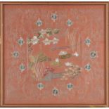 A Chinese silk embroidered picture, early 20th century, decorated with a lotus pond within a foliate