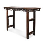 A Chinese hardwood altar table, early 20th century, the rectangular top above pierced scroll