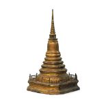 A large Burmese gilt metal stupa, 19th century, with tapering column on galleried canted square