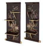 A pair of Chinese lacquered folding shelves, early 20th century, painted with phoenixes perched on