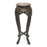 A Chinese hardwood marble inset jardinière stand, late 19th century, the circular top inlaid with