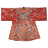 A Chinese silk embroidered coral-ground robe, early 20th century, embroidered with baskets bearing