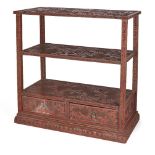 A cinnabar lacquer table-top display stand, 19th century, the three shelves finely carved with