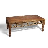 A Chinese huali wood low table, kang, 19th century, the rectangular top above scroll decorated