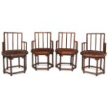 A set of four Chinese yumu armchairs, Republic period, with spindle backs above shaped recessed seat